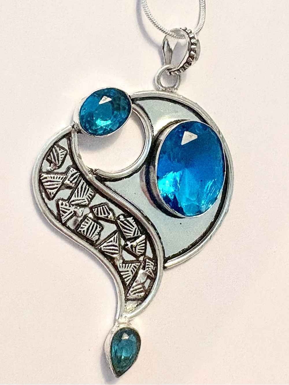 Beautiful, 3 inch, 925 marked, 3 faceted, Blue Topaz gemstone on a silver chain.